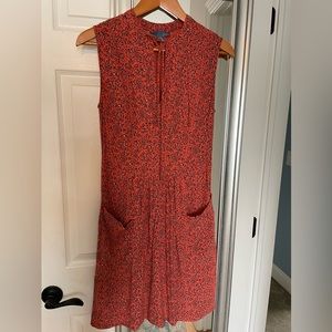 Mid length sleeveless dress.